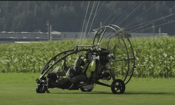 Scientists in a microlight aircraft. 