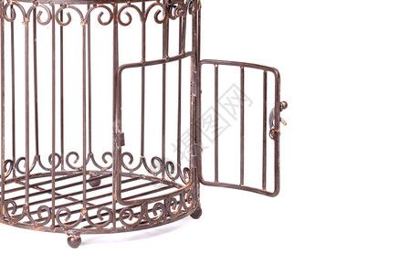 白背景上的空鸟笼雀白色监狱金属栅栏圆形鸟笼宠物俘虏高清图片