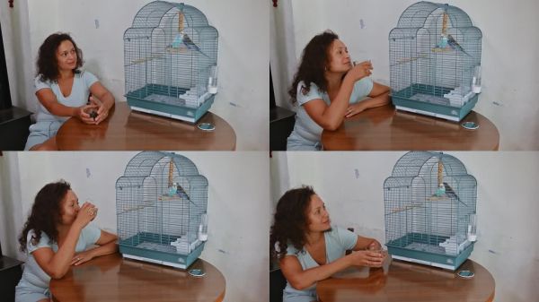 女人在家中与笼子里的宠物鸟享受宁静的时刻，突显了温馨室内环境中陪伴的快乐。